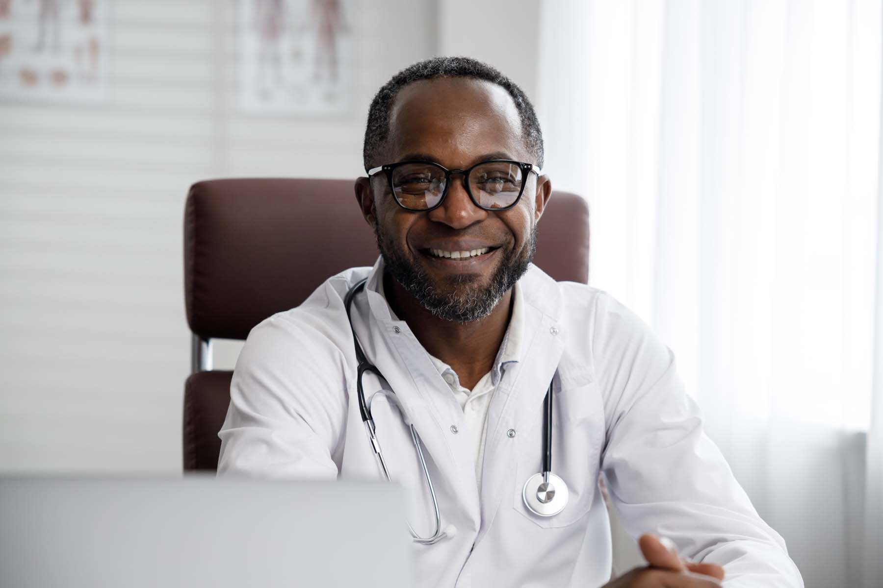 african-american-male-doctor-welcomes-online-patie-2022-12-03-20-28-32-utc.jpg